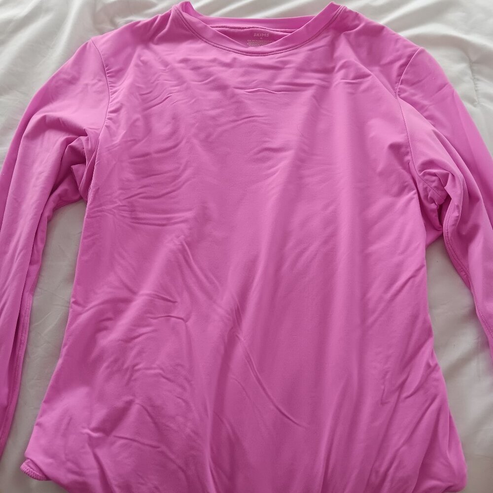 Skims long sleeve body suit.